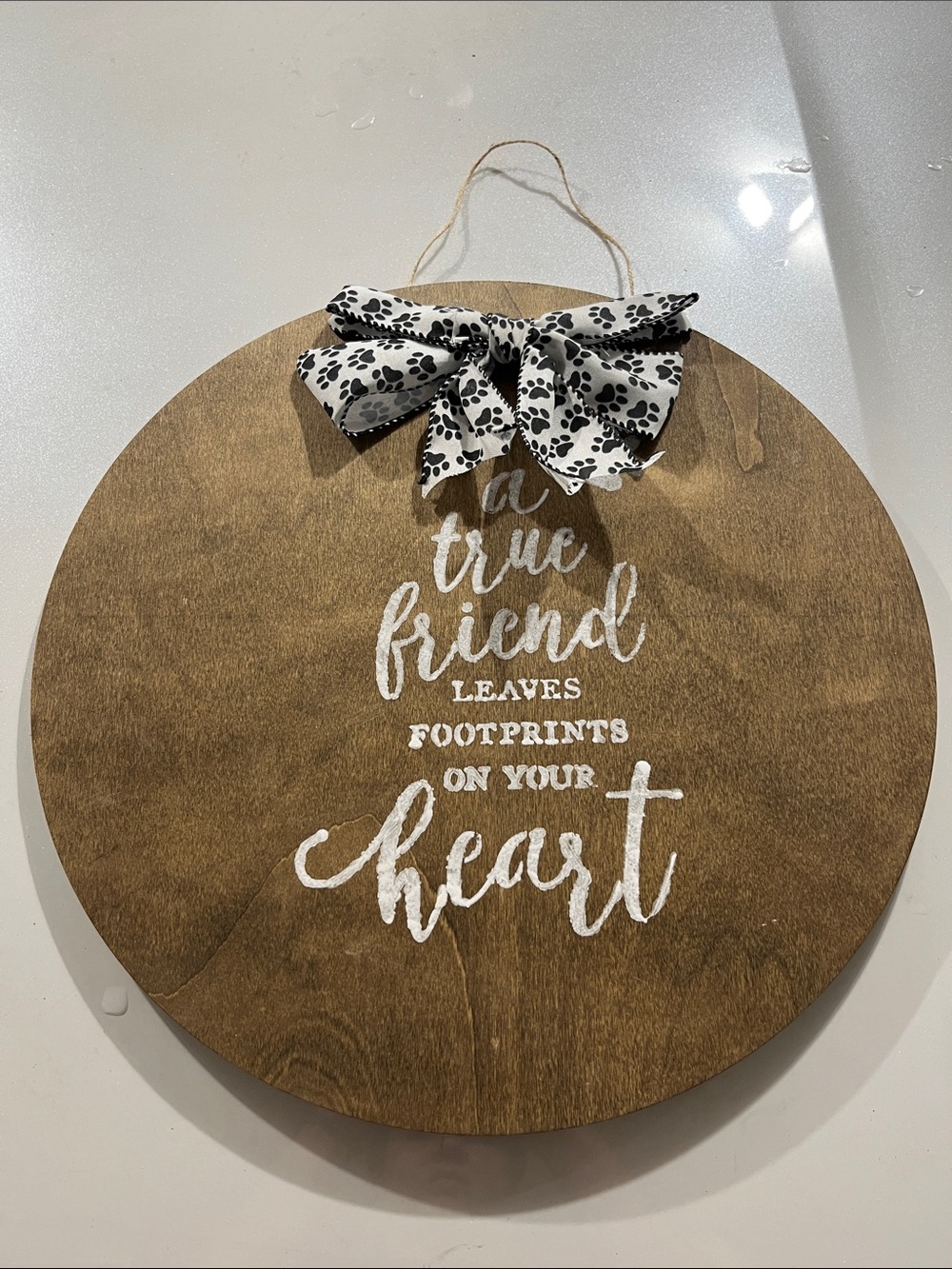 Rustic Brown Wood Wall Sign with White Script and Paw-Print Bow